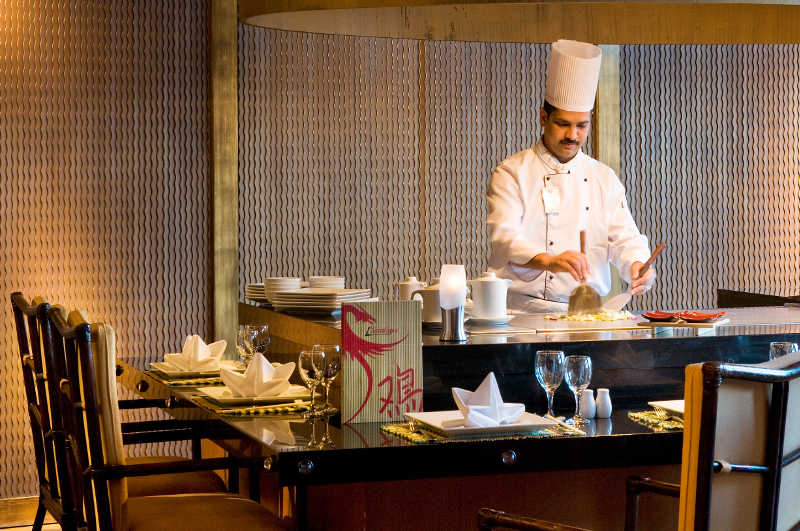 The chef at L'asiatique restaurant prepares fresh food for the guests in Taba Heights Egypt