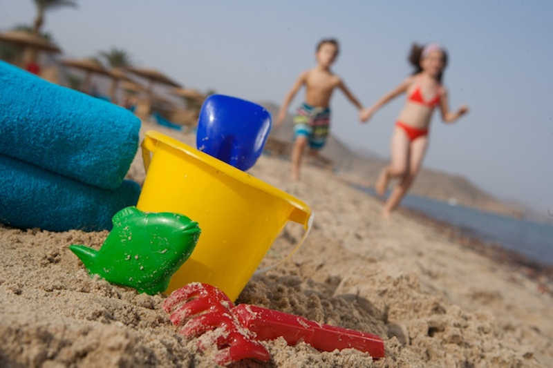 Kids play at the beach of Mosaique hotel in Taba Heights Sinai