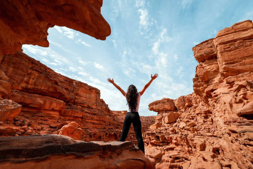 A girl enjoys her time in Red Canyon at the heart of Red Sea Mountains in Taba Egypt