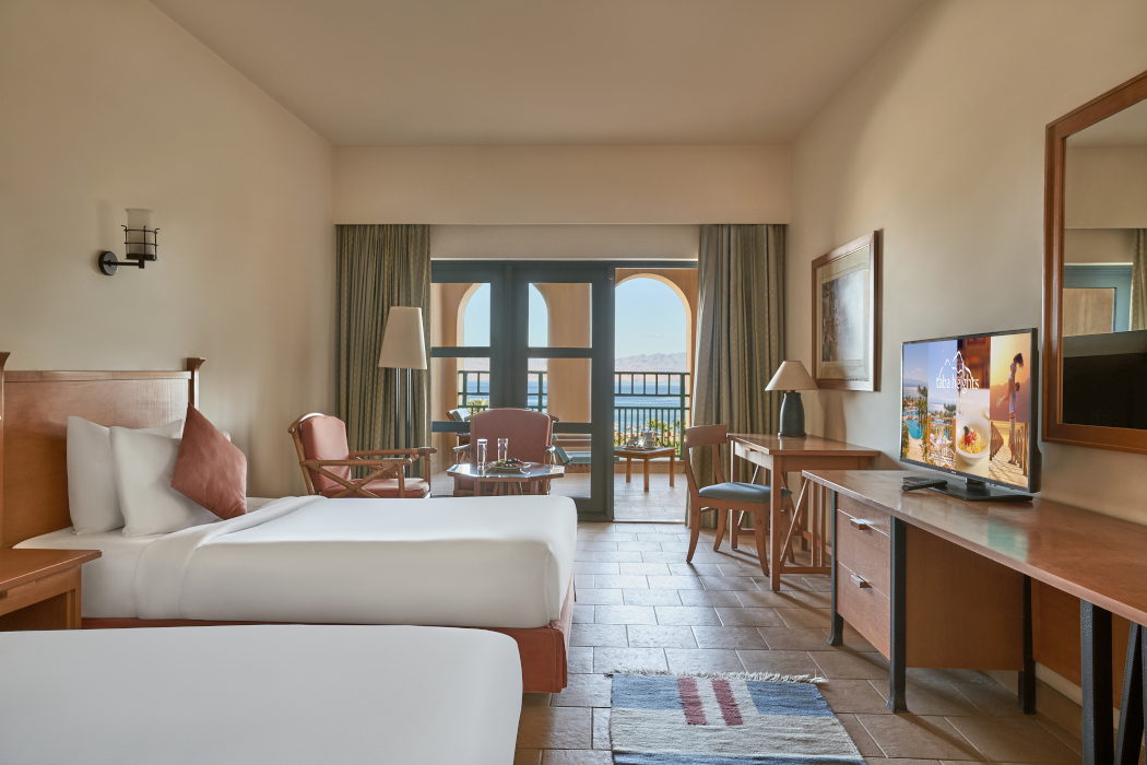 Sea View Twin Bed room with a TV and Sitting area at Strand Beach resort, Taba heights