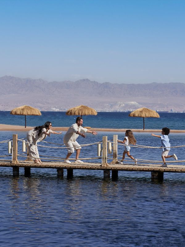 A family having fun together on the beach Taba Heights Sinai
