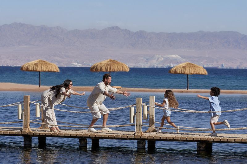 A family having fun together on the beach Taba Heights Sinai
